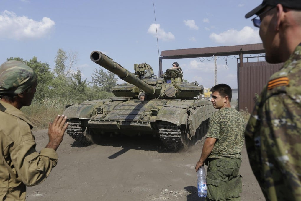 Pro-Russian rebels park a tank near the town of Krasnodon, eastern Ukraine. The rebels say they have been reinforced. Photo: AP