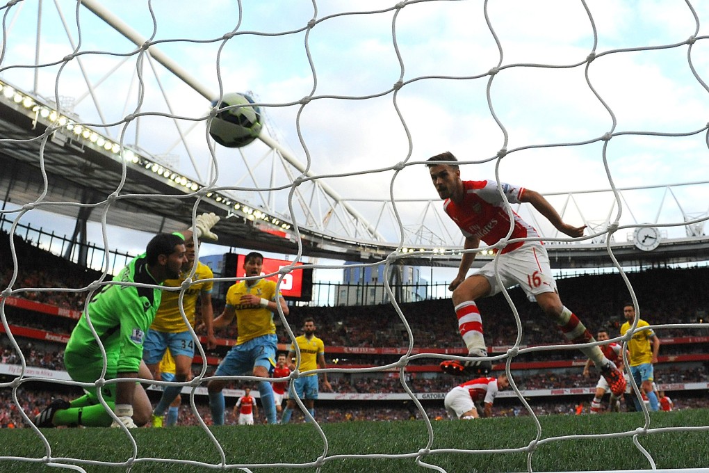 Arsenal’s Aaron Ramsey scores his team's second goal against Crystal Palace. Photo: AFP