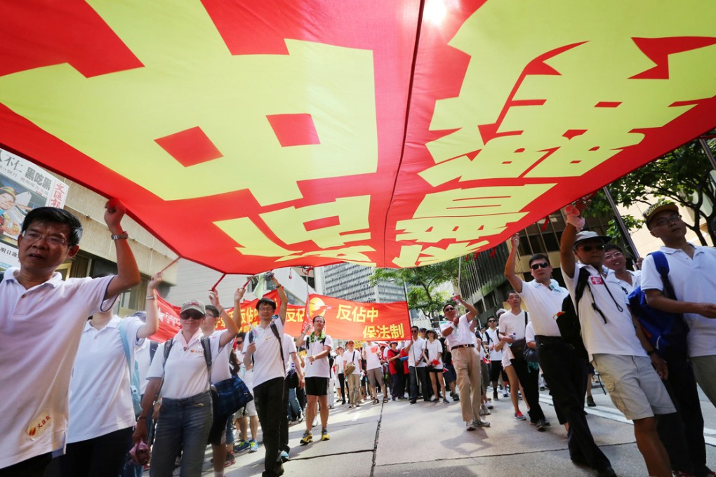 Hongkongers opposed to the Occupy Central movement take part in yesterday's march organised by the Alliance for Peace and Democracy. Photo: Felix Wong