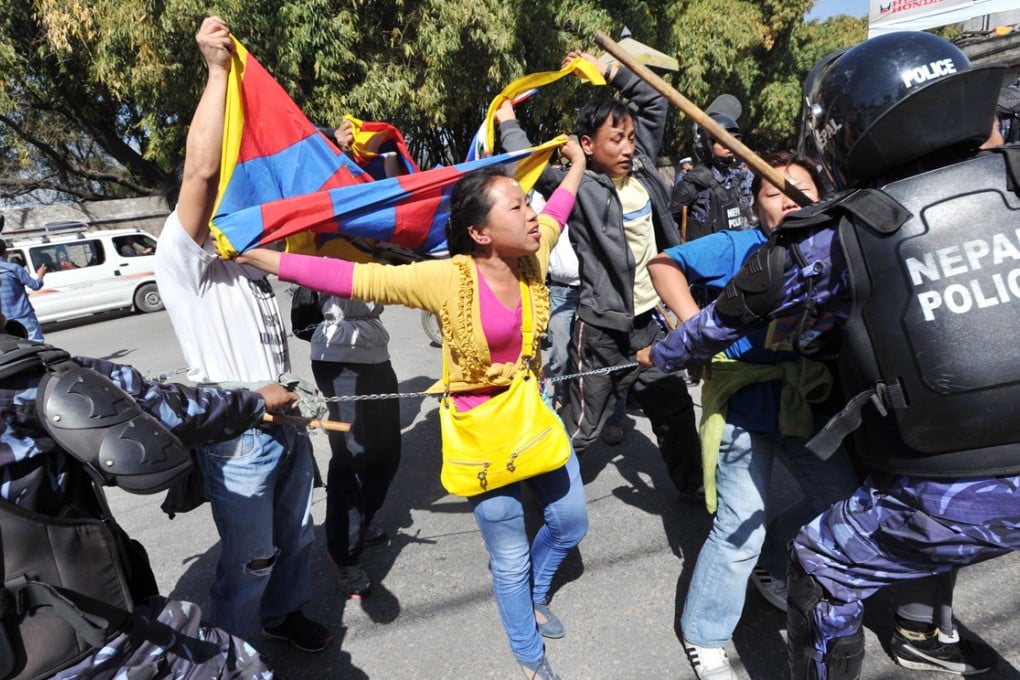 Nepalese riot police arrest Tibetans during a protest in Kathmandu in 2012 to mark the 53rd anniversary of the 1959 Tibetan uprising against Chinese rule. Photos: AP