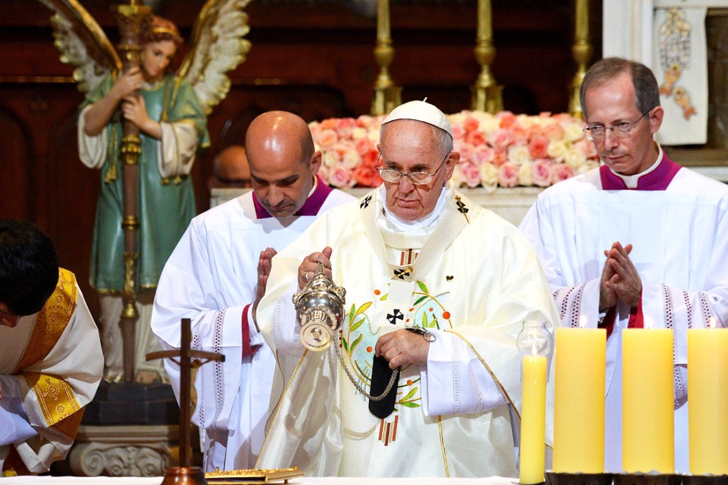 Pope Francis (centre) celebrates a mass in Seoul's Myeongdong Cathedral. Photo: AFP