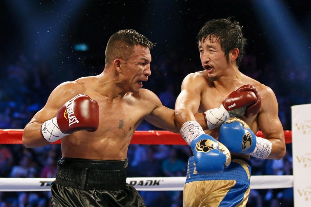 Zou Shiming in his last bout, against Colombian Luis De La Rosa in a WBO flyweight title clash in Macau last month. Photo: AP