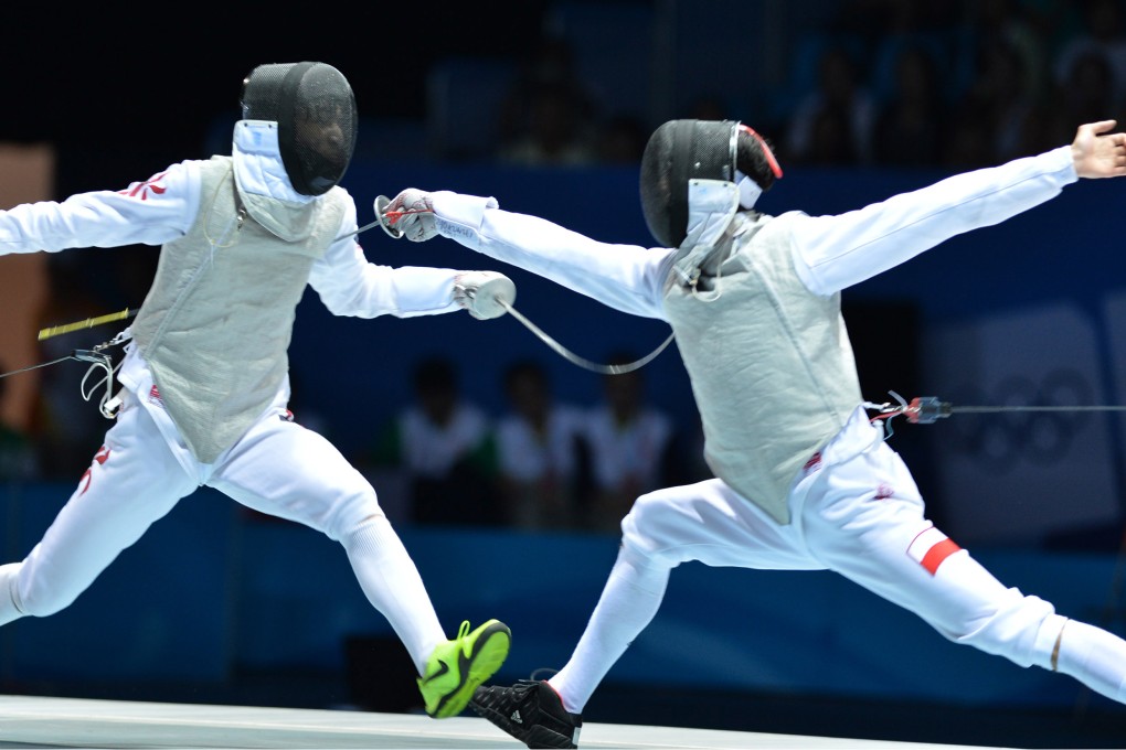 Hong Kong's Ryan Choi (left) during the individual foil final against world junior champion Andrzej Rzadkowski of Poland. Chol won the silver medal. Photo: Xinhua