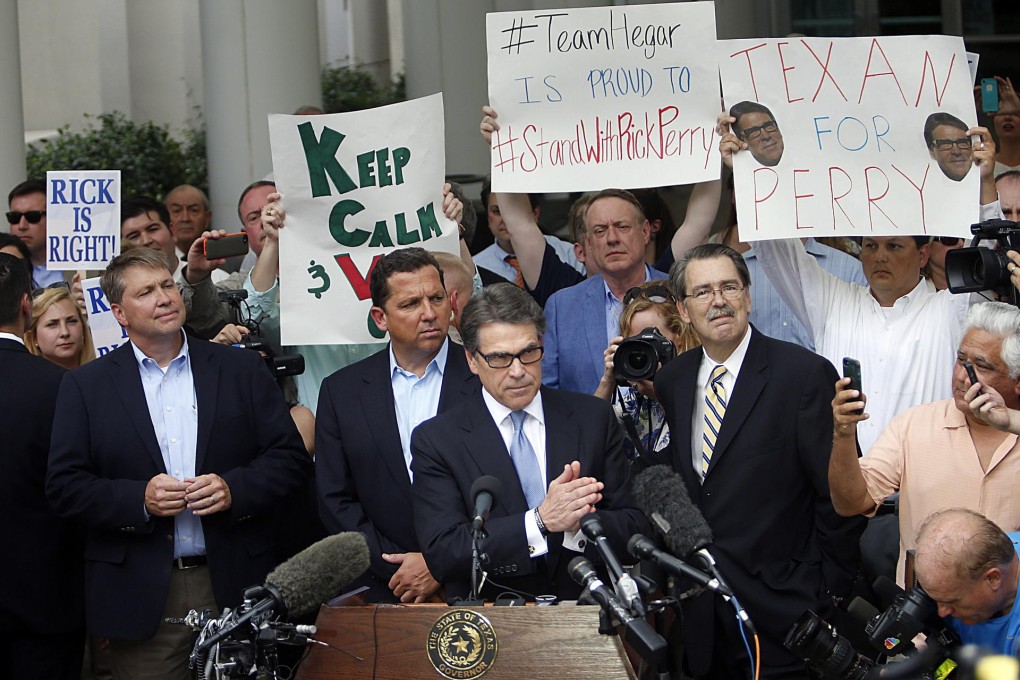 Rick Perry (centre) with supporters in Austin. The Republican and US presidential contender is the first Texas governor to be indicted in a century.Photos: AFP, Reuters