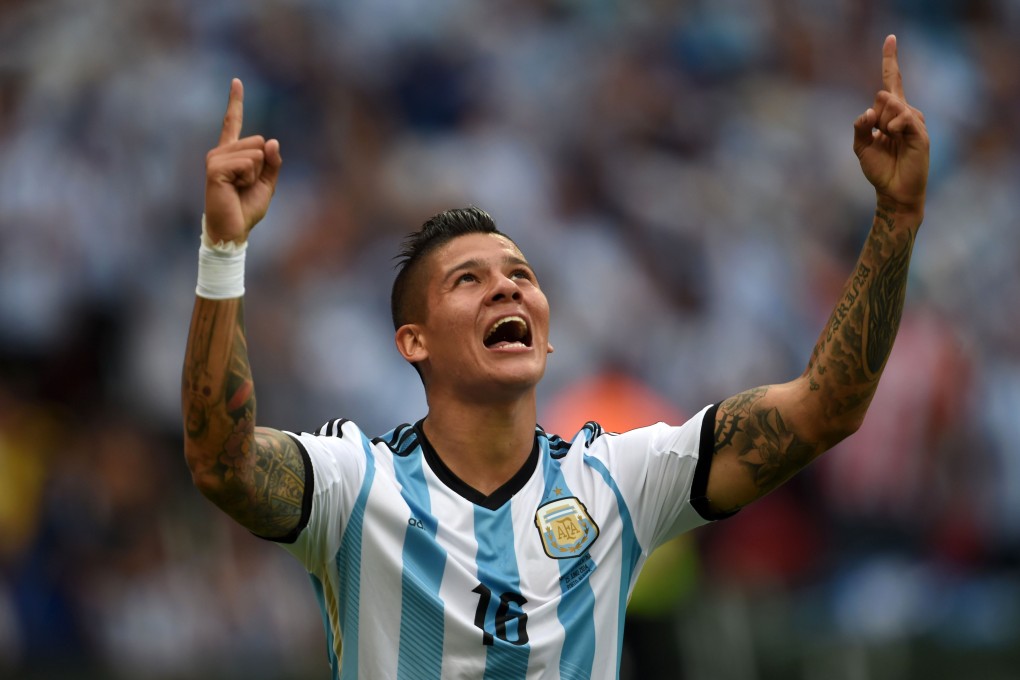 Marcos Rojo celebrates scoring at the World Cup. Photo: AFP