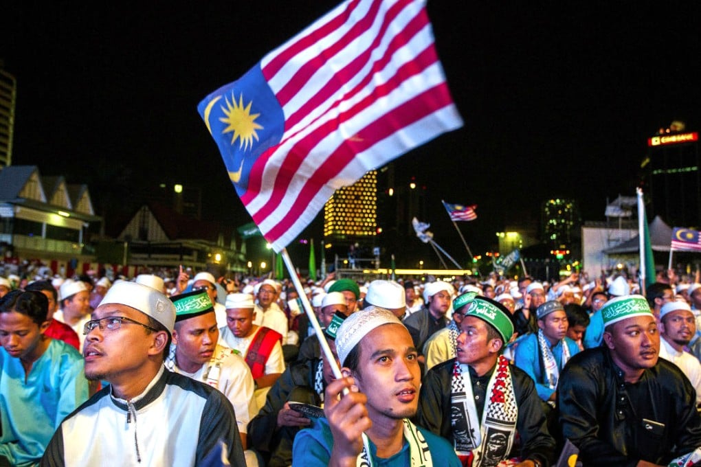 Malaysian Muslims attend a "Pray for Malaysia" event at Independence Square in Kuala Lumpur on Friday. Malaysian police have foiled plans for a wave of bombings drawn up by radical Islamic militants inspired by the hardline Islamic State jihadist group, a counter-terrorism official said. Photo: EPA