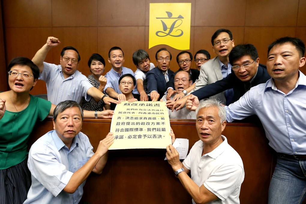 Some of the 26 pan-democrat lawmakers who signed the declaration at the Legislative Council yesterday. Photo: K.Y. Cheng