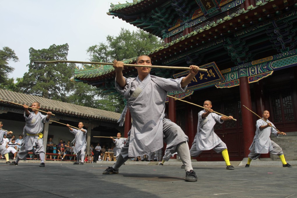 Martial arts practitioners train at the Shaolin Temple in Henan province, one of China's most popular tourist attractions. Photo: Imagine China