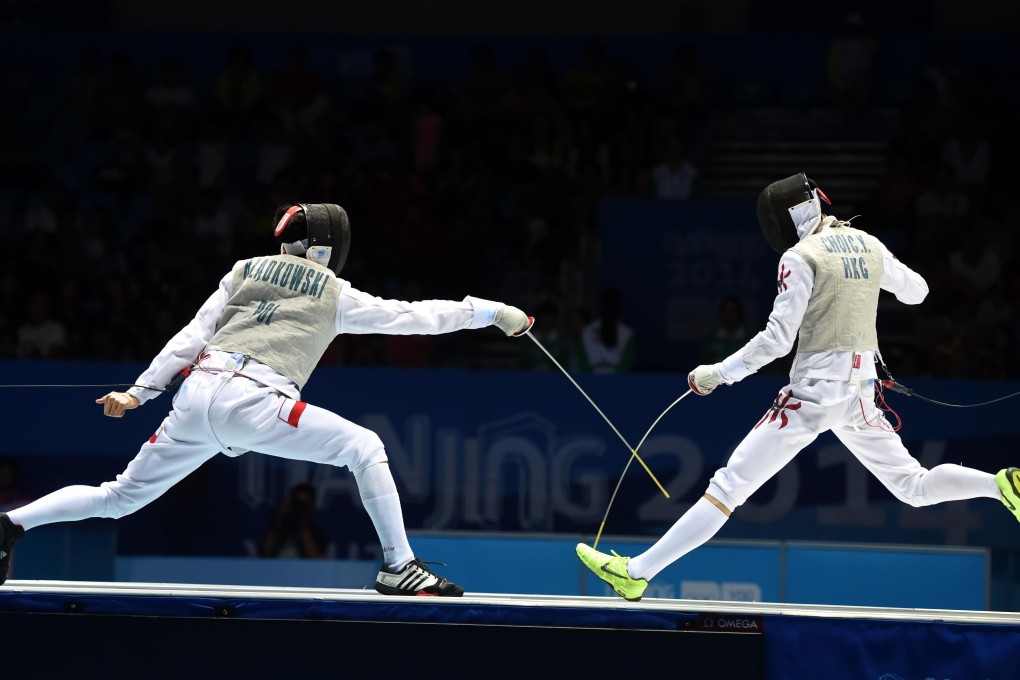 Ryan Choi in action for team Asia-Oceania-1 against Andrzej Rzadkowski. Photo: Xinhua