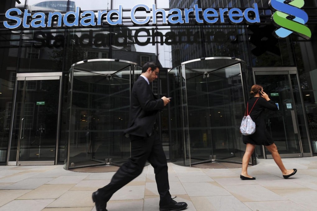Standard Chartered will temporarily suspend dollar-clearing services to "certain retail business clients" in Hong Kong. Photo: EPA