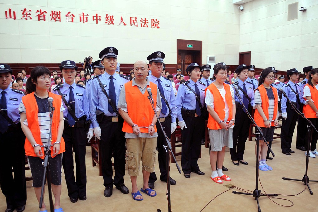 The five accused face trial in Yantai city for beating a woman to death at a McDonald's. Photo: Xinhua