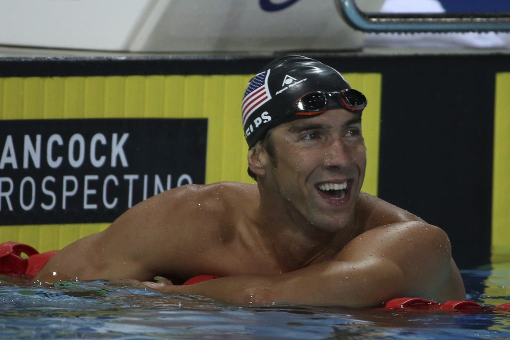 Michael Phelps of the US is still all smiles despite finishing fourth in the men's 100m free at the Pan Pacific championships. Photo: AP