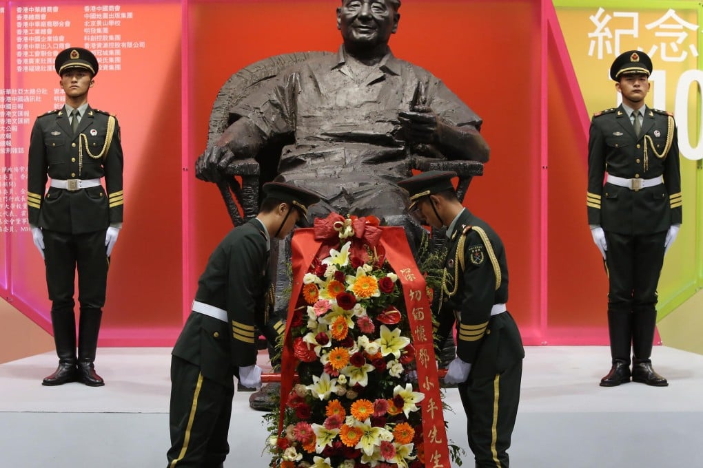 A statue of Deng Xiaoping commemorates the 110th anniversary of his birth at the Hong Kong Convention Centre. Photo: Sam Tsang
