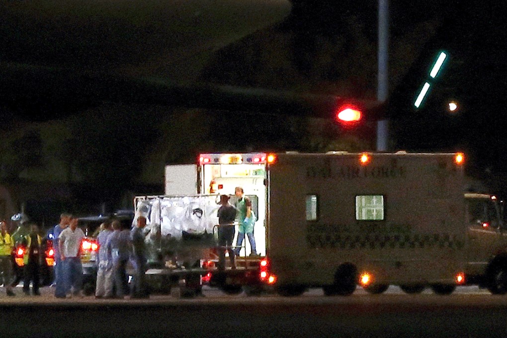 The British man infected with the Ebola virus is loaded into an Royal Air Force (RAF) ambulance after being flown home on a C17 plane from Sierra Leone. Photo: Reuters