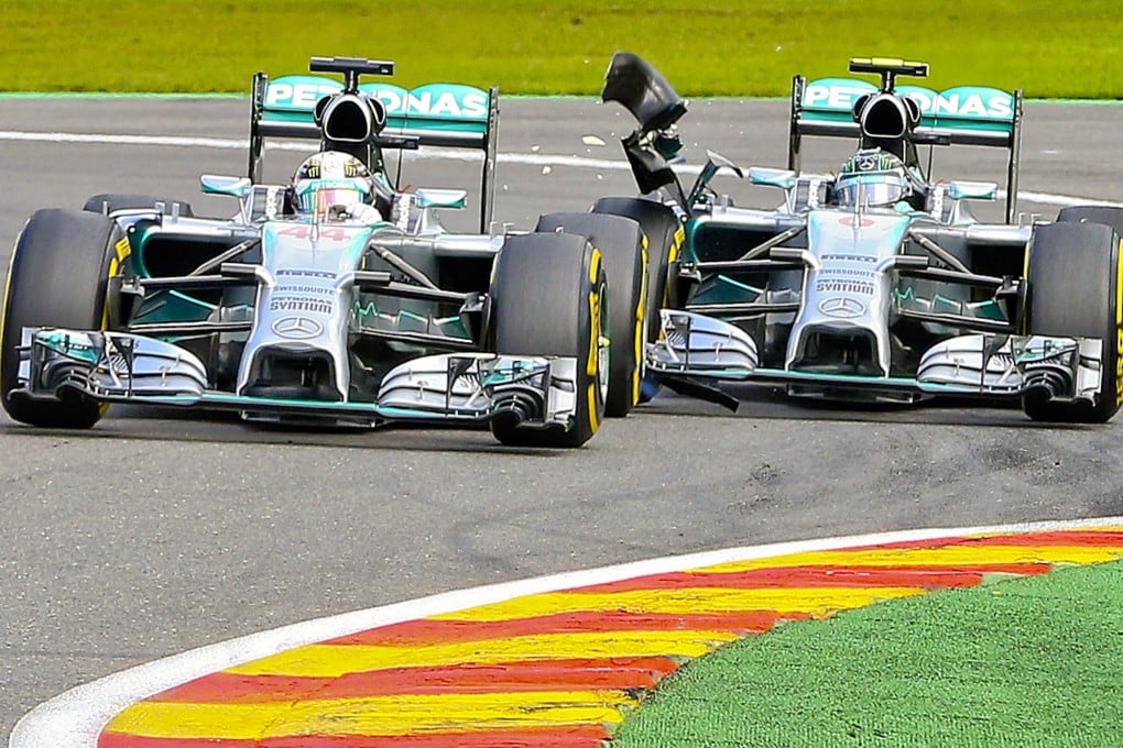 Lewis Hamilton and Nico Rosberg collide on the second lap at the Belgian Grand Prix in Spa-Francorchamps. Photo: AP