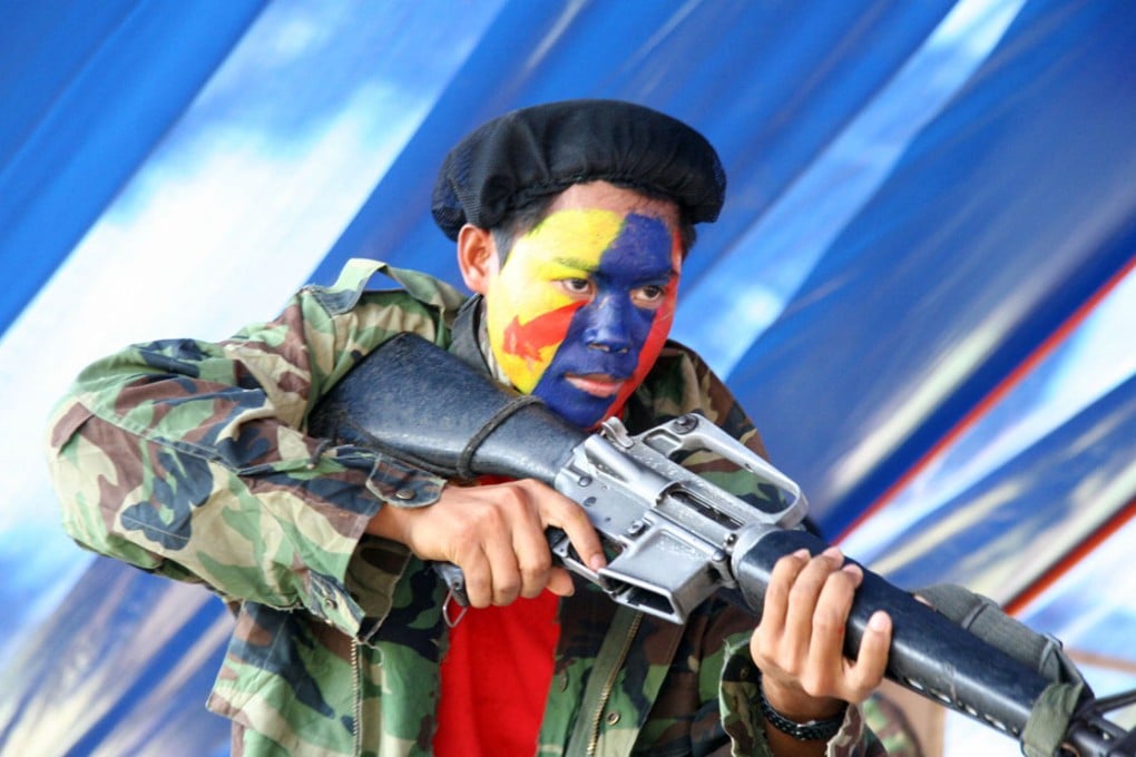 A young New People's Army (NPA) guerrilla. The NPA is the armed wing of the Communist Party of the Philippines, which has been waging an insurgency since 1969 that has left tens of thousands dead.