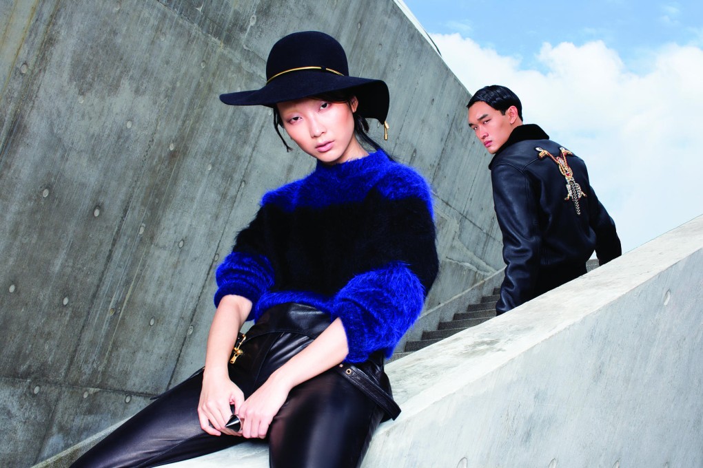 Ruby wears knit top (HK$5,480) by Sportmax. Leather overalls (HK$31,720) by Pucci. Hat (HK$7,300) by Lanvin. Resin and brass ring (HK$4,800) by Giorgio Armani. 
Tse Wei wears leather jacket (HK$92,900) by Versace.