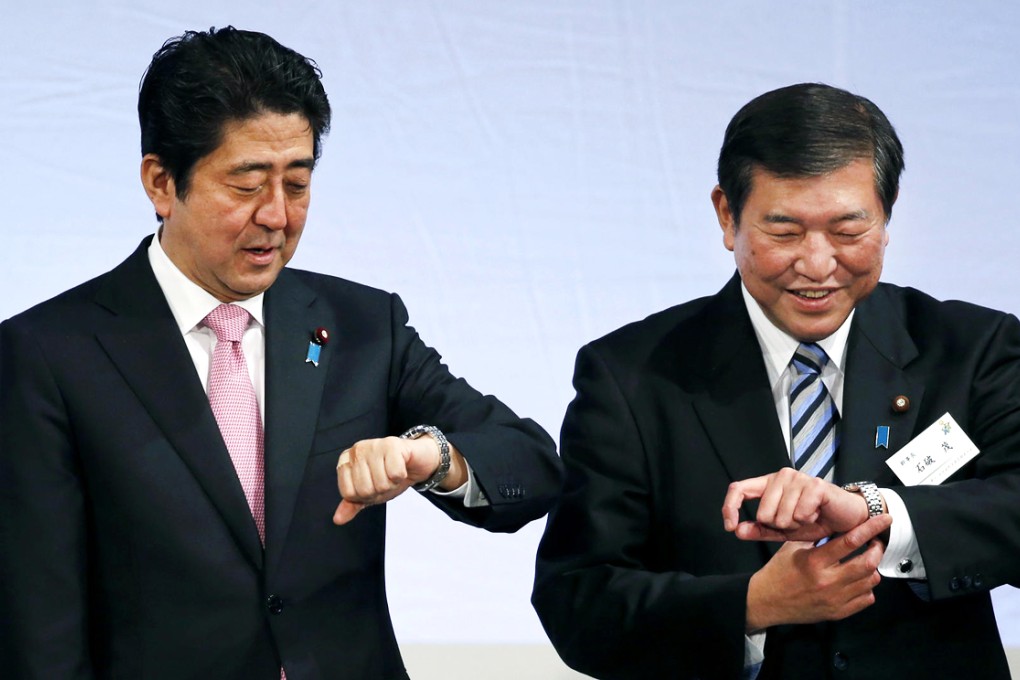 Shigeru  Ishiba (left) is in sharp disagreement with Abe on defence and security policies. Photo: AP