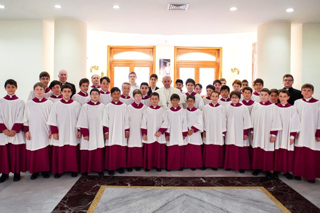 Members of the choir pose with Pope Francis. Photo: SCMP Pictures