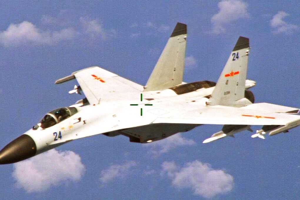 A Chinese J-11 fighter jet is seen flying near a US Navy P-8 Poseidon east of China's Hainan Island. Photo: Reuters