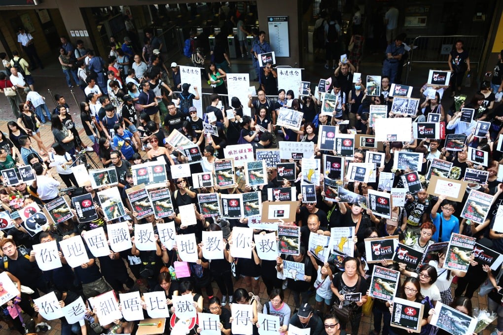 Protesters mourning the dog's death gather at the Sheung Shui MTR station. Photo: David Wong
