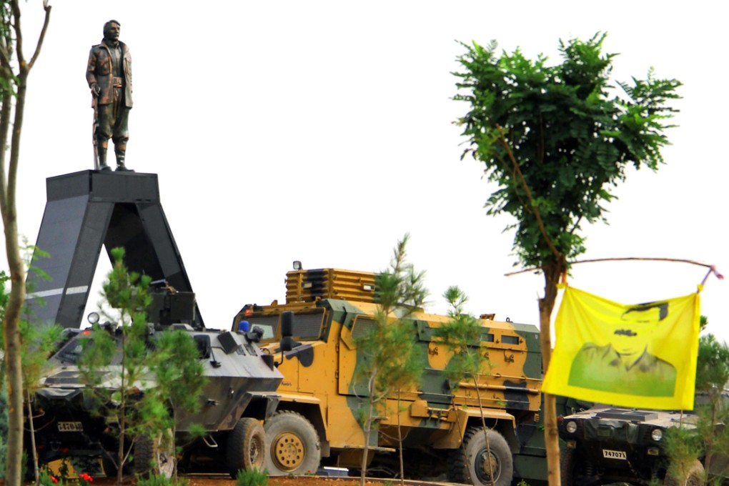 A statue depicting Mahsum Korkmaz, one of the founders of the Kurdistan Workers' Party (PKK), surrounded by Turkish armoured vehicles. The Chinese workers were seized by suspected members of the PKK. Photo: AFP