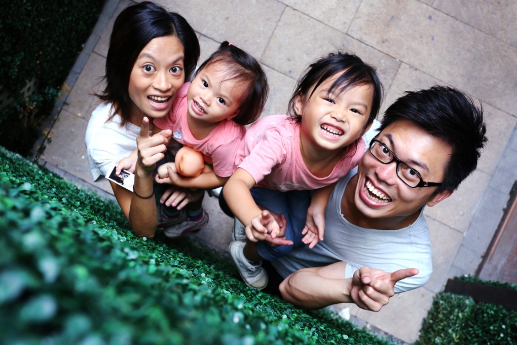 Social workers Li Koon-kiu and wife Vicki Poon Ka-lee, founders of Doctor BB – a programme in which children visit homes for the elderly – with daughters Li Hei-yi, four, and Li Sumying, two. The pair are on the shortlist for this year's Spirit of Hong Kong Awards organised by the South China Morning Post, which recognise outstanding achievements. Photo: Nora Tam