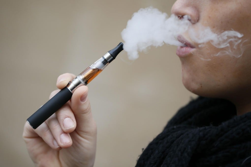 The e-cigarette devices, which have surged in popularity in particular among young people, function by heating flavoured nicotine liquid into a vapour that is inhaled - much like traditional cigarettes, but without the smoke.