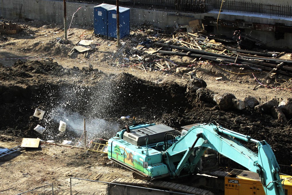 Police bomb disposal officers destroy the Japanese wartime explosive with a controlled blast in North Point yesterday afternoon. Photo: SCMP Pictures