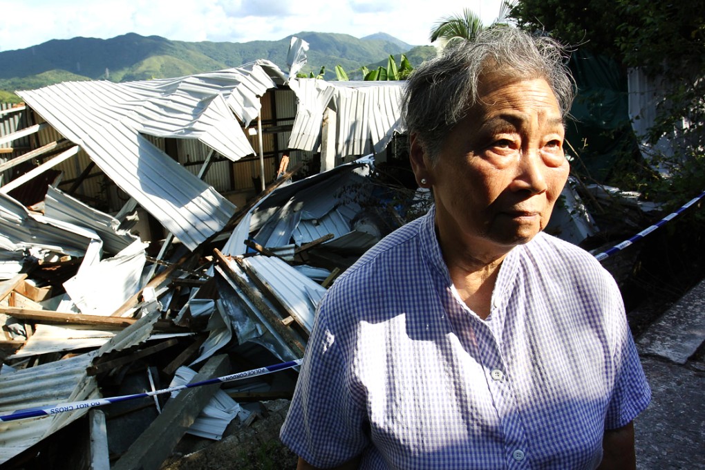Ho Mei-woon, 78, stands amid the ruins of her workshop on land she is understood to have rented since the 1960s. Photo: Dickson Lee