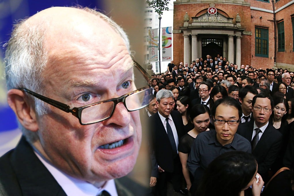 The UK Supreme Court's president Lord Neuberger (left) says he saw "no present problem" with the city's rule of law. Hundreds of Hong Kong lawyers stage three minutes of silence outside the Court of Final Appeal in Hong Kong, following a march in protest against Beijing's policy towards the judiciary, on June 27, 2014. Photos: Sam Tsang, Felix Wong