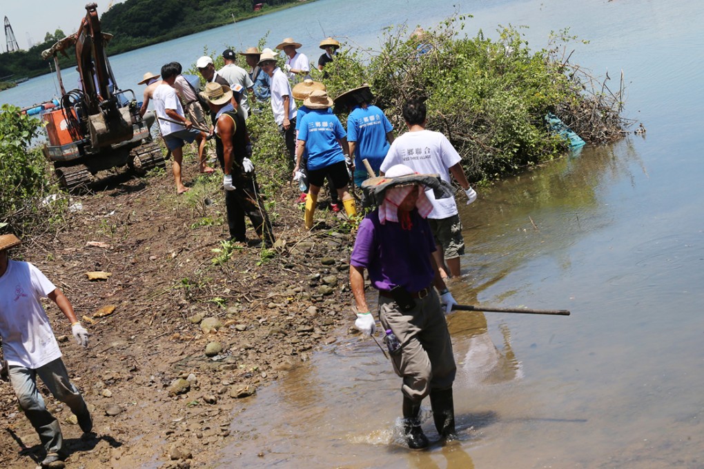 Villagers of San Heung protest against a plan to draw a Site of Special Scientific Interest in the country park enclave of Tai Ho, North Lantau Island, by chopping down trees in the forest.