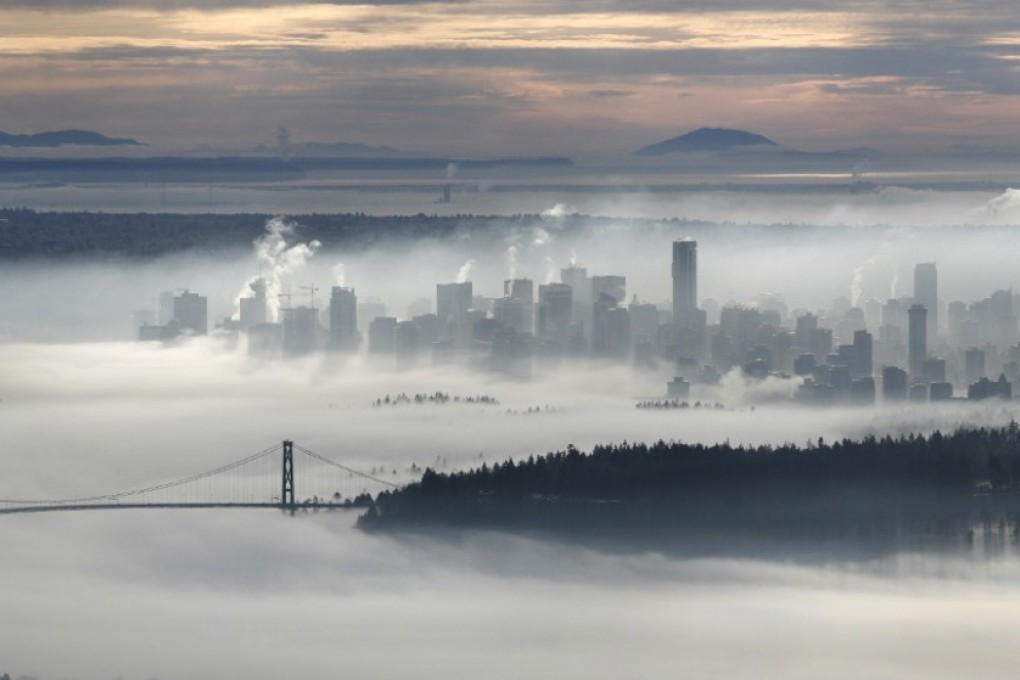 The downtown of Vancouver and the Lions Gate Bridge rise above a morning fog in this view from Cypress Mountain in West Vancouver, British Columbia. Photo: Reuters