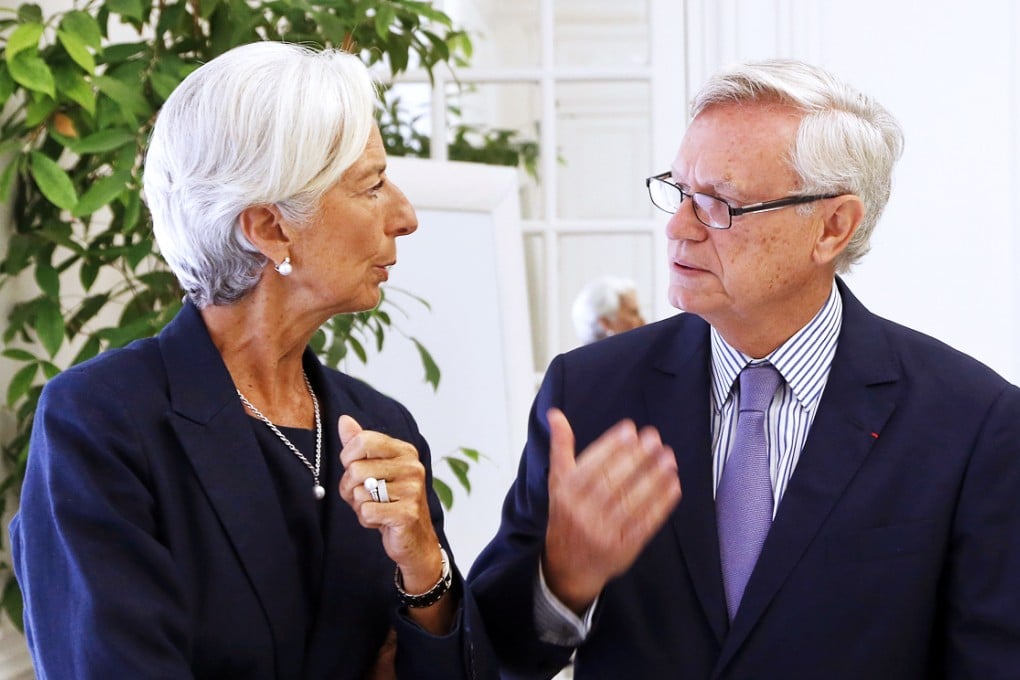 IMF chief Christine Lagarde speaks to her lawyer, Yves Repiquet, in Paris. Photo: AFP