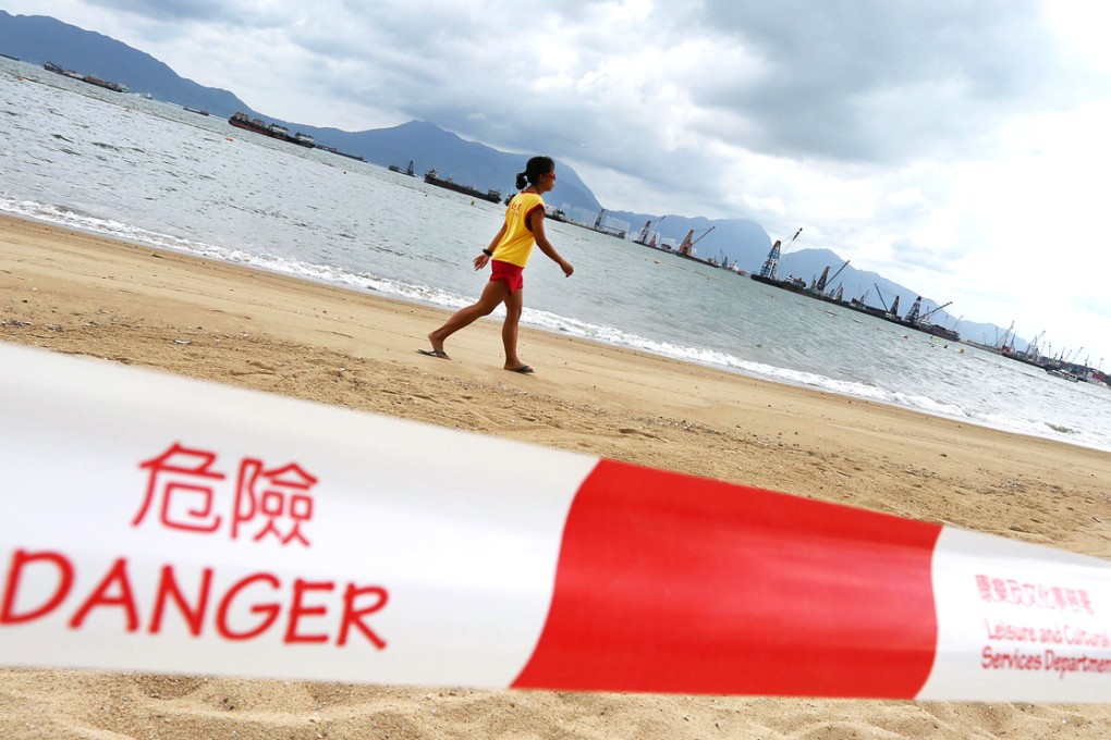 A lifeguard patrols Butterfly Beach, one of several popular swimming spots that was closed after raw sewage was discharged. Photo: Nora Tam