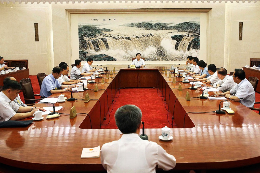 Zhang Dejiang (centre, rear) presides over the 12th NPC Standing Committee at the Great Hall of the People in Beijing. Photo: Xinhua