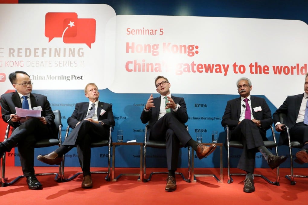 From left, the Post's William Zheng, EY's Bob Partridge, Ian Bolin from Infiniti, Digital Realty's Kris Kumar and Cathay Pacific's Rupert Hogg discuss the problems facing Hong Kong. Photo: Sam Tsang