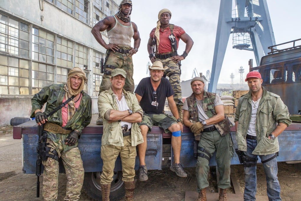 Some old faces, some new, in The Expendables 3's line-up: Terry Crews, Wesley Snipes (back row); Dolph Lundgren, Sylvester Stallone, director Patrick Hughes, Randy Couture and Jason Statham (front).