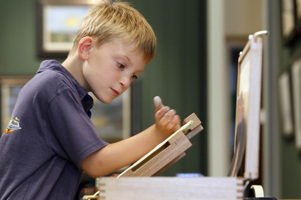 Kieron Williamson is being home-schooled to allow him the flexibility to go outdoors when the mood strikes. His paintings, such as Duck's Crossing, Mevagissey Harbour, and Cattle at St Benet, sell for thousands of dollars. Photos: Kieron Williamson