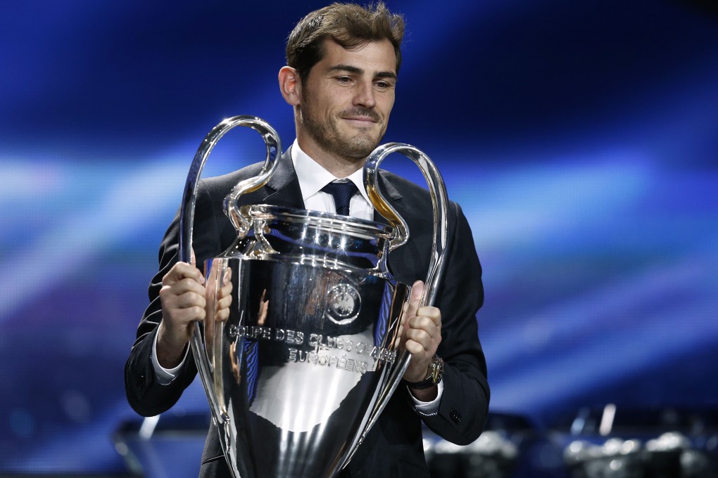 Spain goalkeeper Iker Casillas delivers the trophy. Photo: AFP