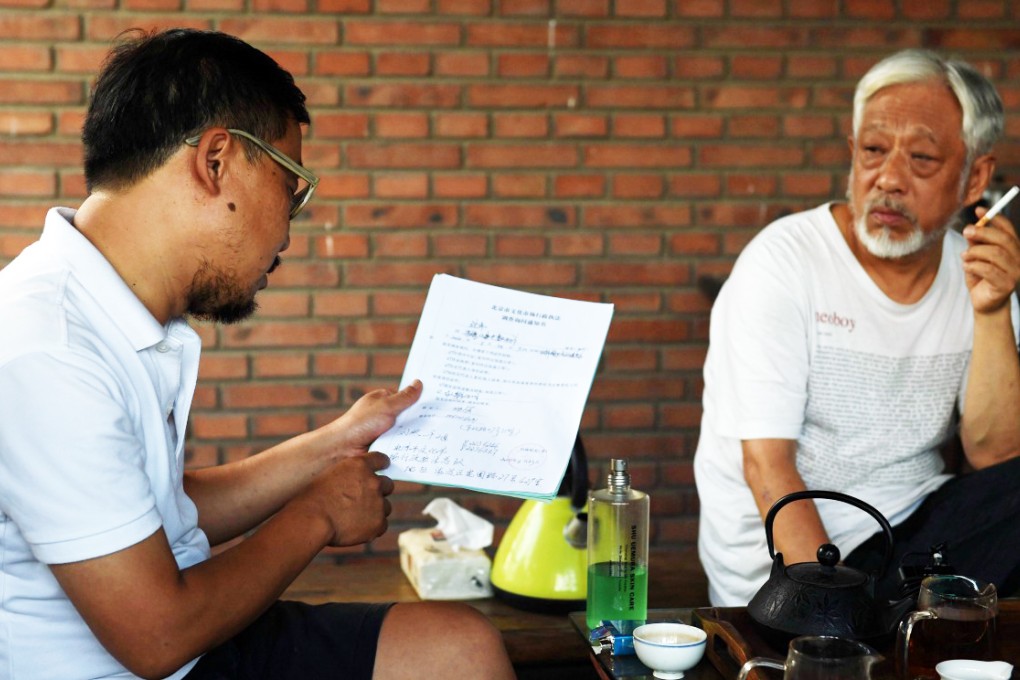 Festival organisers Wang Hongwei (left) and Li Xianting said they were unsure about the future of the event. Photo: AFP