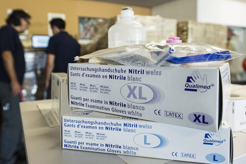 Medical goods bound for Liberia to fight the Ebola outbreak are packed at a centre of the Swiss Red Cross in Wabern. Photo: EPA