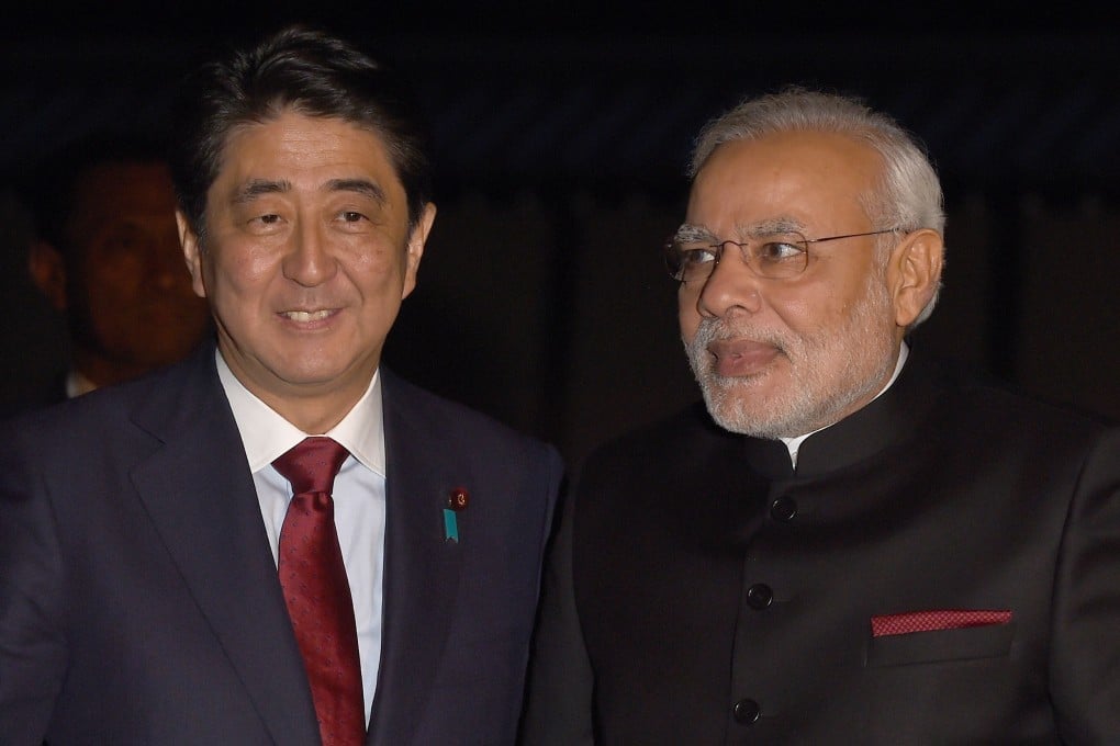 India's new Prime Minister Narendra Modi (right) is welcomed by his Japanese counterpart Shinzo Abe upon his arrival at the State Guest House in Kyoto. Photo: AFP