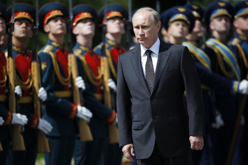 Vladimir Putin attends a ceremony to mark the anniversary of the beginning of the war with Germany in 1941. His recent behaviour fascinates Kremlin watchers. Photo: Reuters