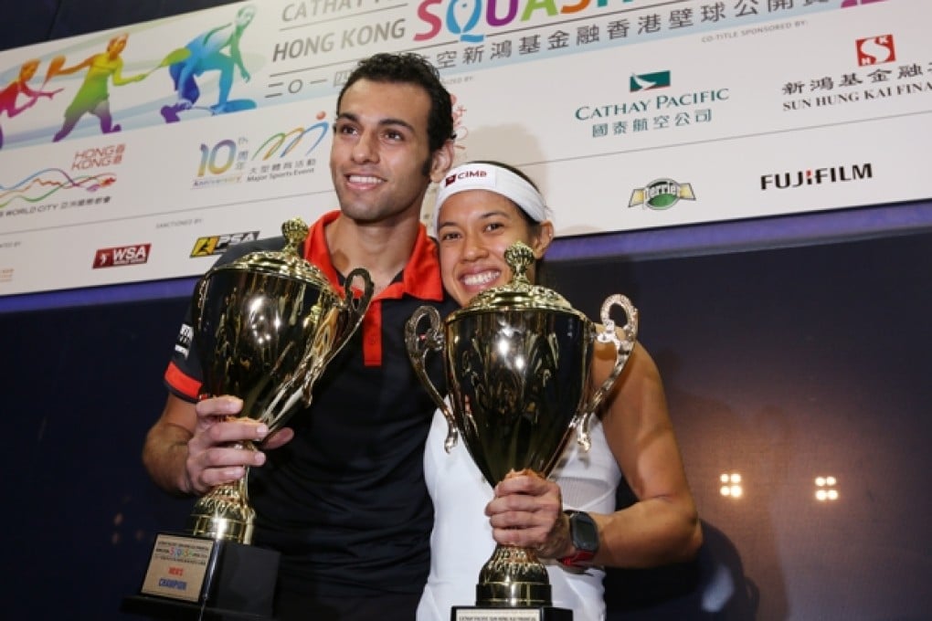 Mohamed Elshorbagy of Egypt and Malaysia's Nicol David show off their spoils at the prize presentation ceremony. Photo: Nora Tam