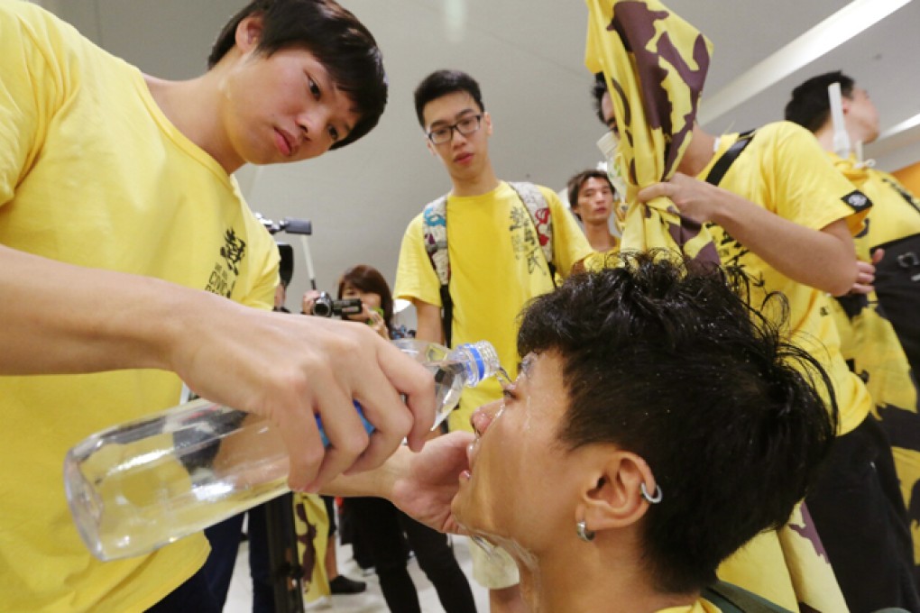 The eyes of a young protester are washed after police used pepper spray. Photo: SCMP