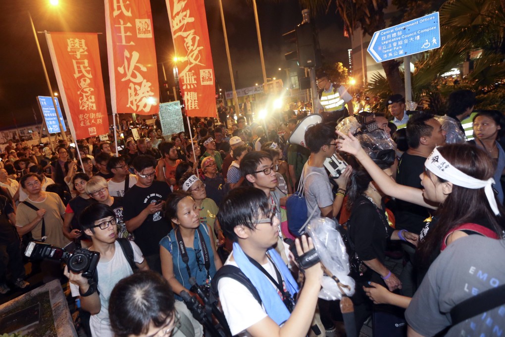 Members of Scholarism await the arrival of Li Fei outside the Grand Hyatt Hotel in Wan Chai. Photo: SCMP