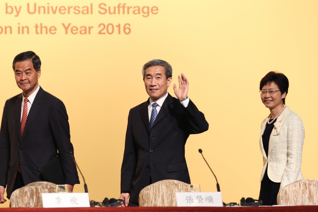 Leung Chun-ying walks with Li Fei (centre) and Carrie Lam Cheng Yuet-ngor (right), as they arrive for a briefing session on constitutional development of Hong Kong. Photo: SCMP