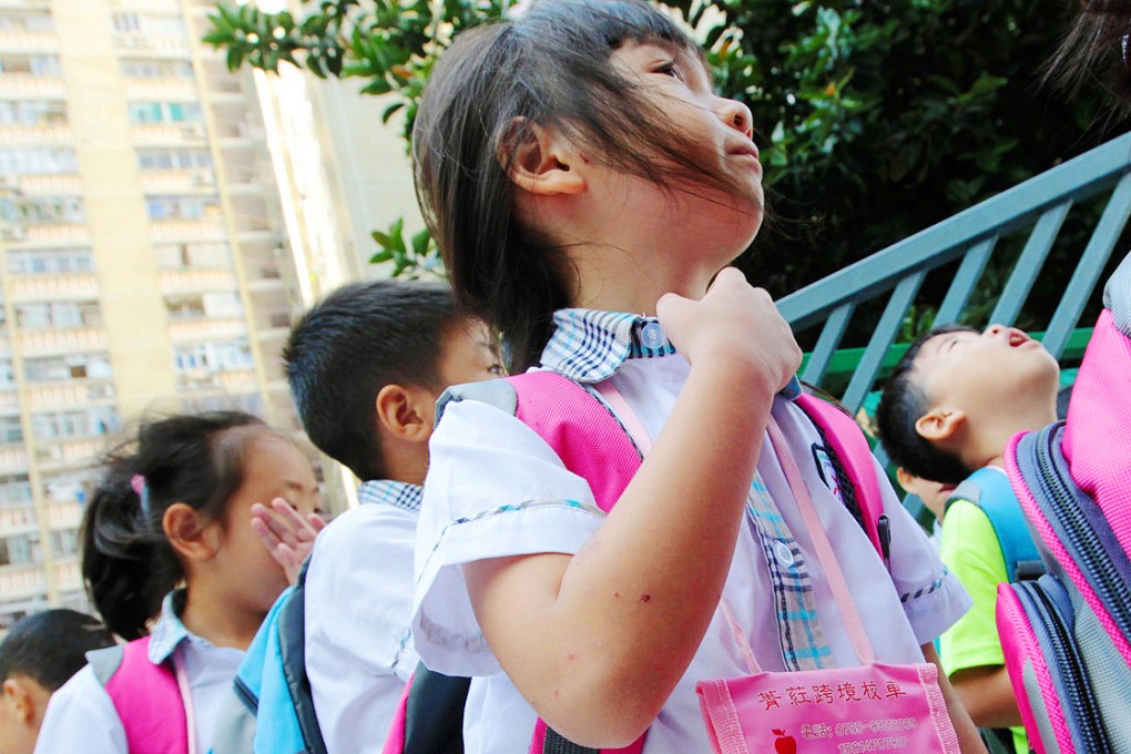 The weary cross-border pupils arrive at Baptist Rainbow Primary School. Photo: Bruce Yan