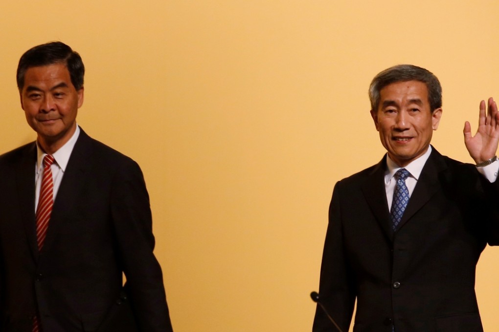 Li Fei (right) and Leung Chun-ying attended a briefing session yesterday.